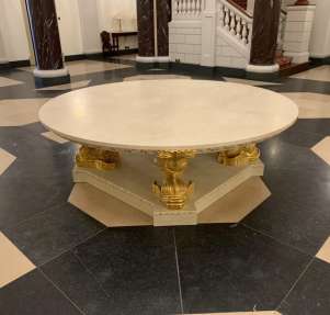 Elegant marble tabletop resting on a bespoke piece of furniture.