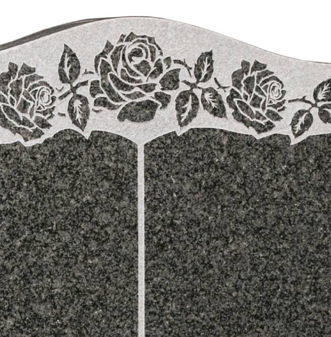 Granite headstone memorial featuring a detailed rose carving.